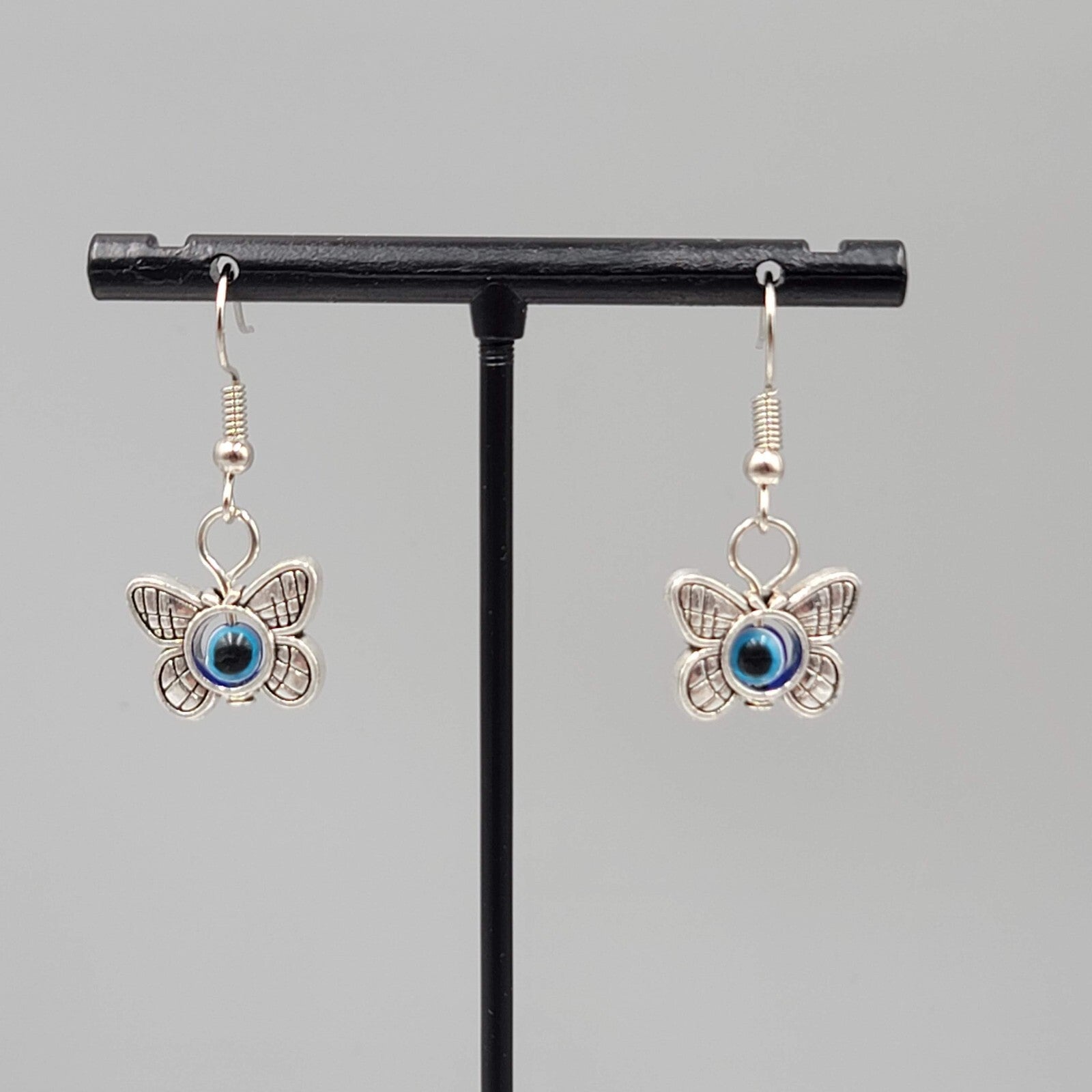 Butterfly Evil Eye Pierced Earrings Silver tone Blue Bead Dangle 5/8"