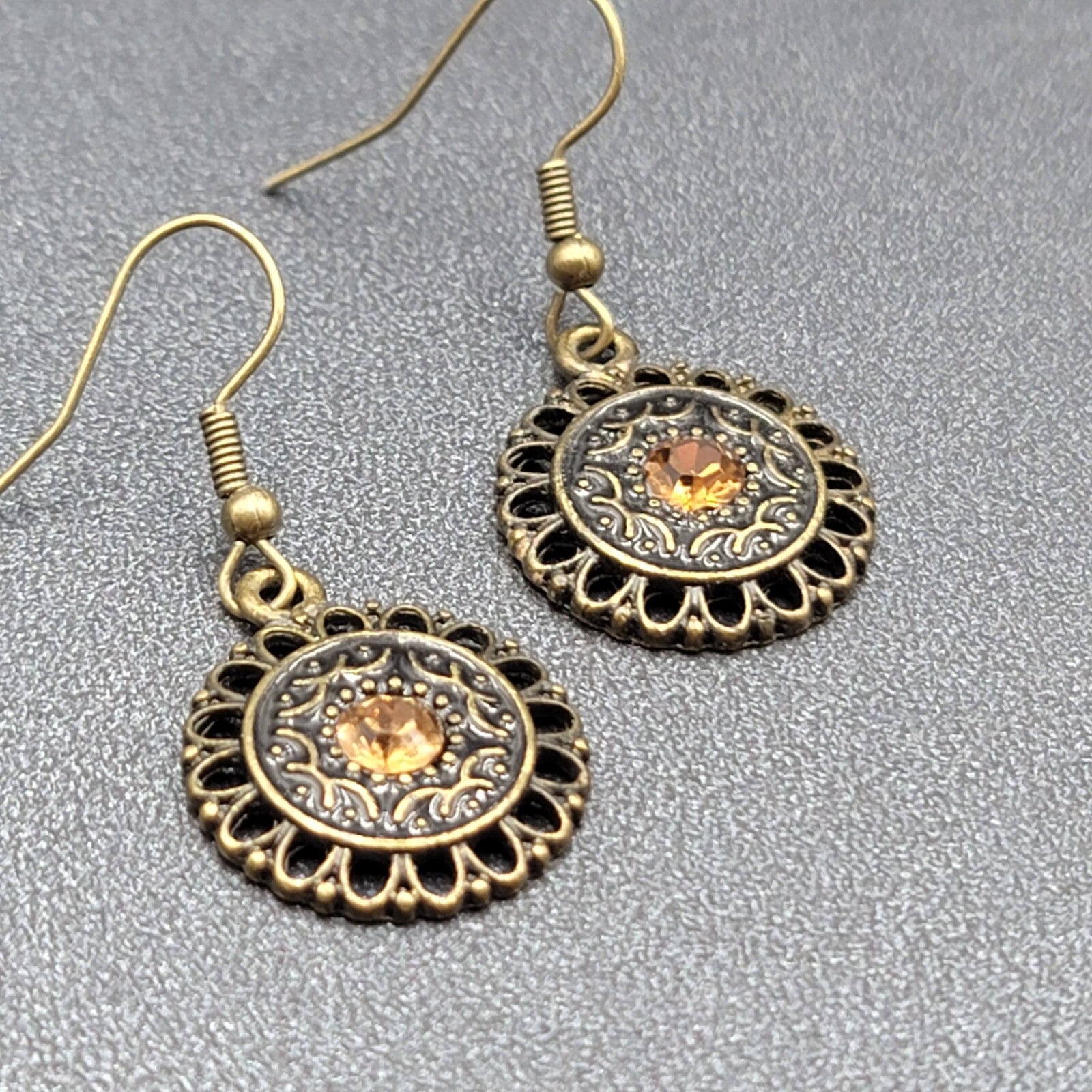Pierced Earrings Bronze tone Orange Rhinestone Round Filigree 7/8"