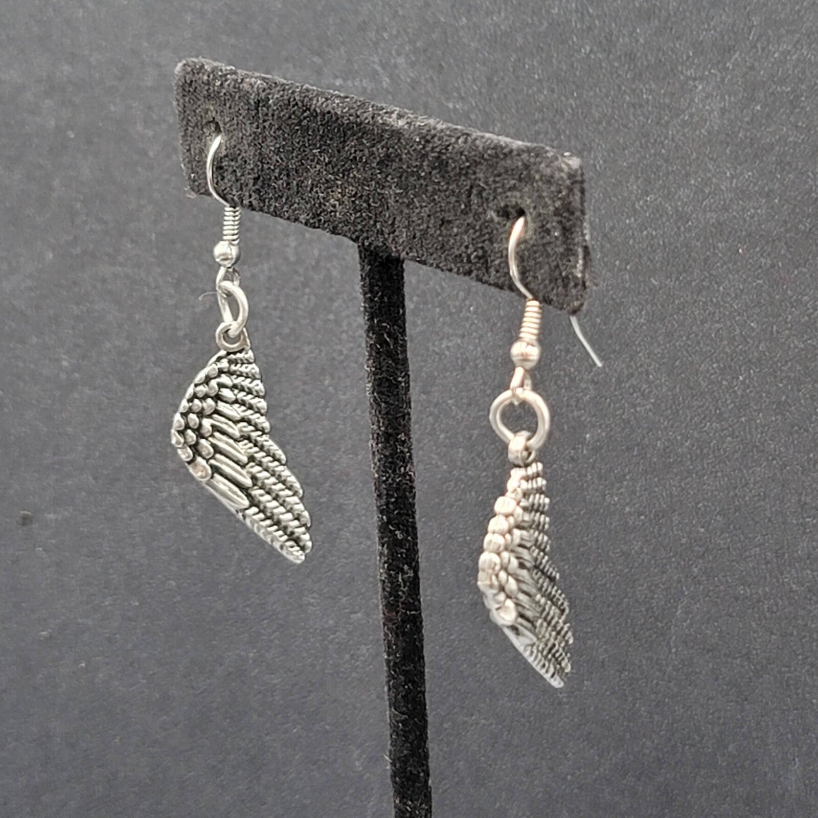 Pierced Earrings Silver tone Detailed Wings Dangle 1 1/8"