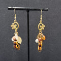 Pierced Earrings Gold tone Pottery Flower Bead Dangle Leaves 2"