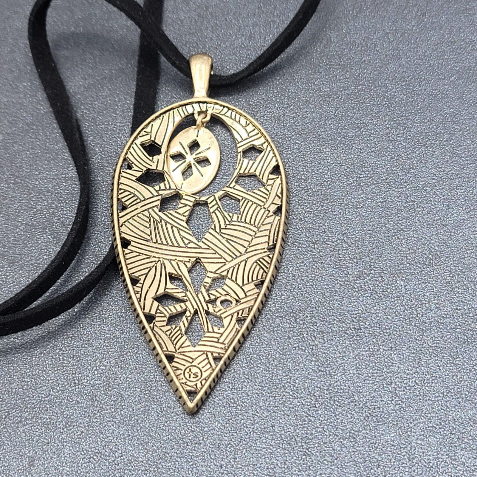 The Sak Necklace Gold tone Pendant Black Faux Leather Cord 28"