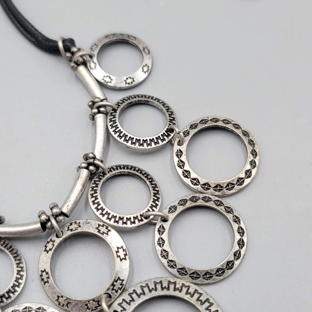 Multiple Open Rings Necklace Embossed Silver tone Black Cord 18"