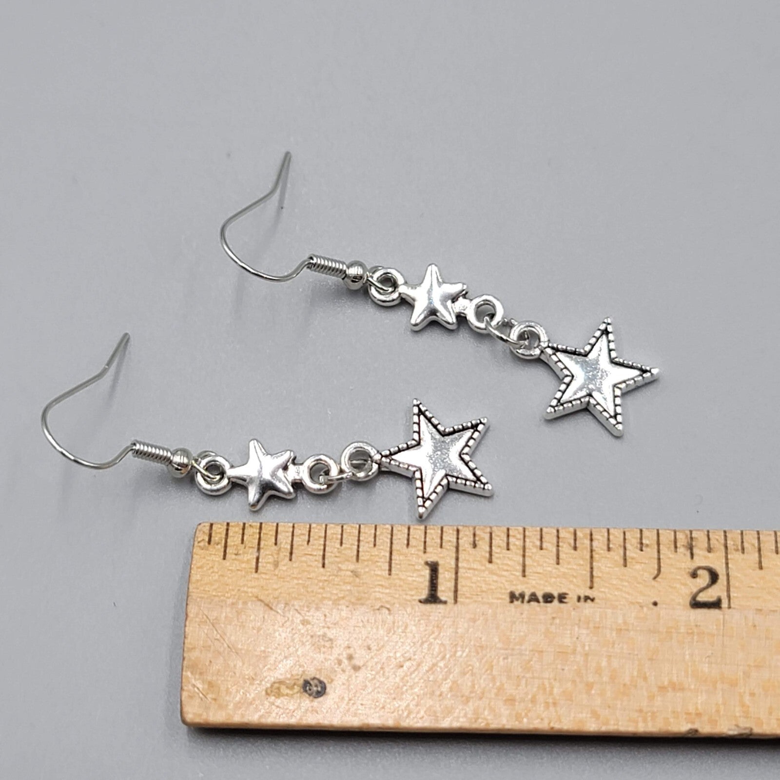 Stars Pierced Earrings Silver tone Embossed Dangle New 1 1/8"