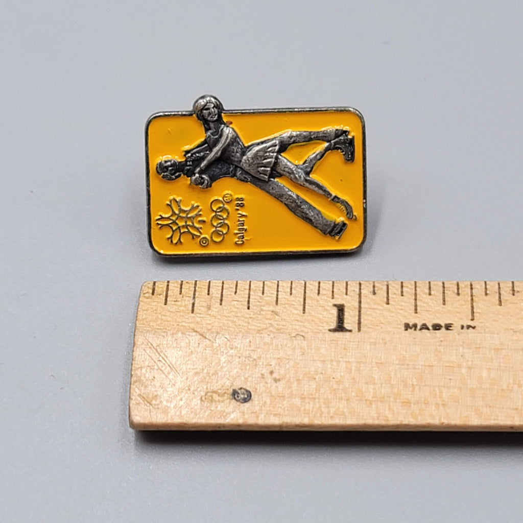 Calgary 88 Olympic Winter Games Lapel Pin Ice Skating Couples Yellow Enamel 1"
