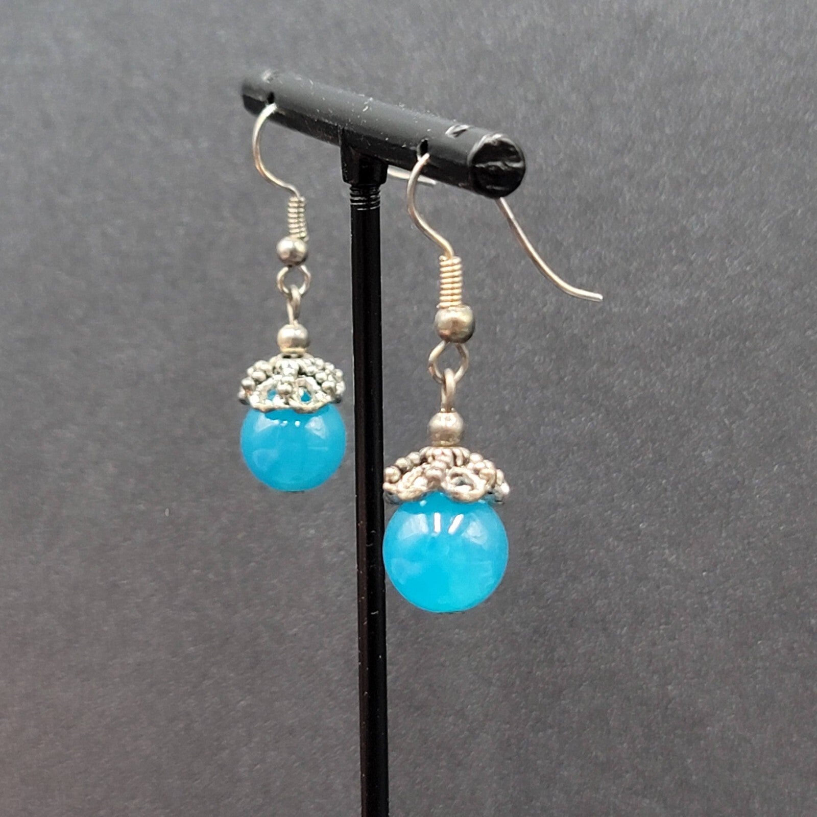Pierced Earrings Silver tone Filigree Capped Blue Glass Bead Dangle 3/4"