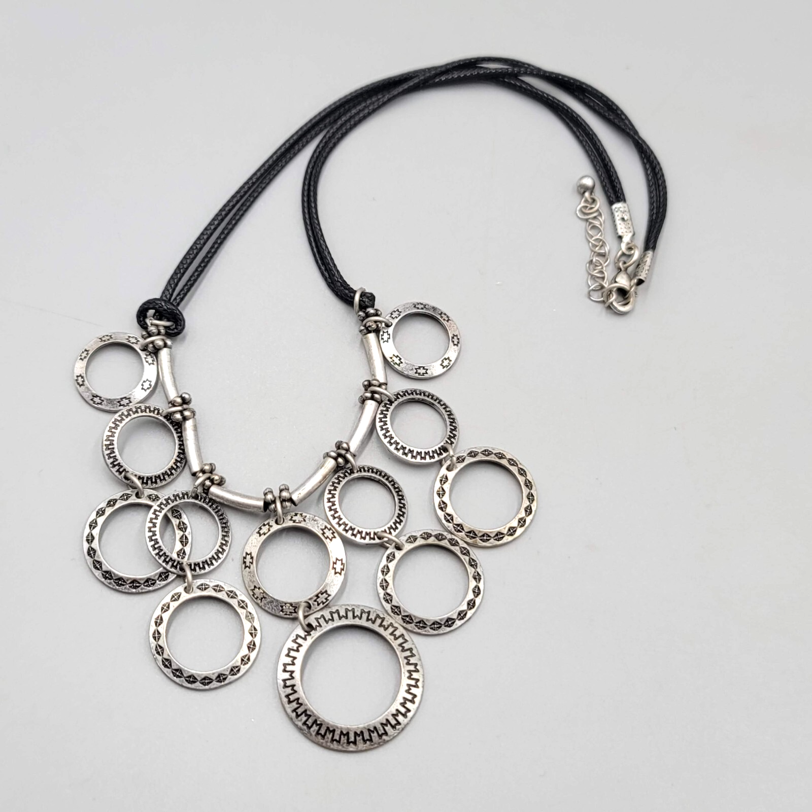 Multiple Open Rings Necklace Embossed Silver tone Black Cord 18"