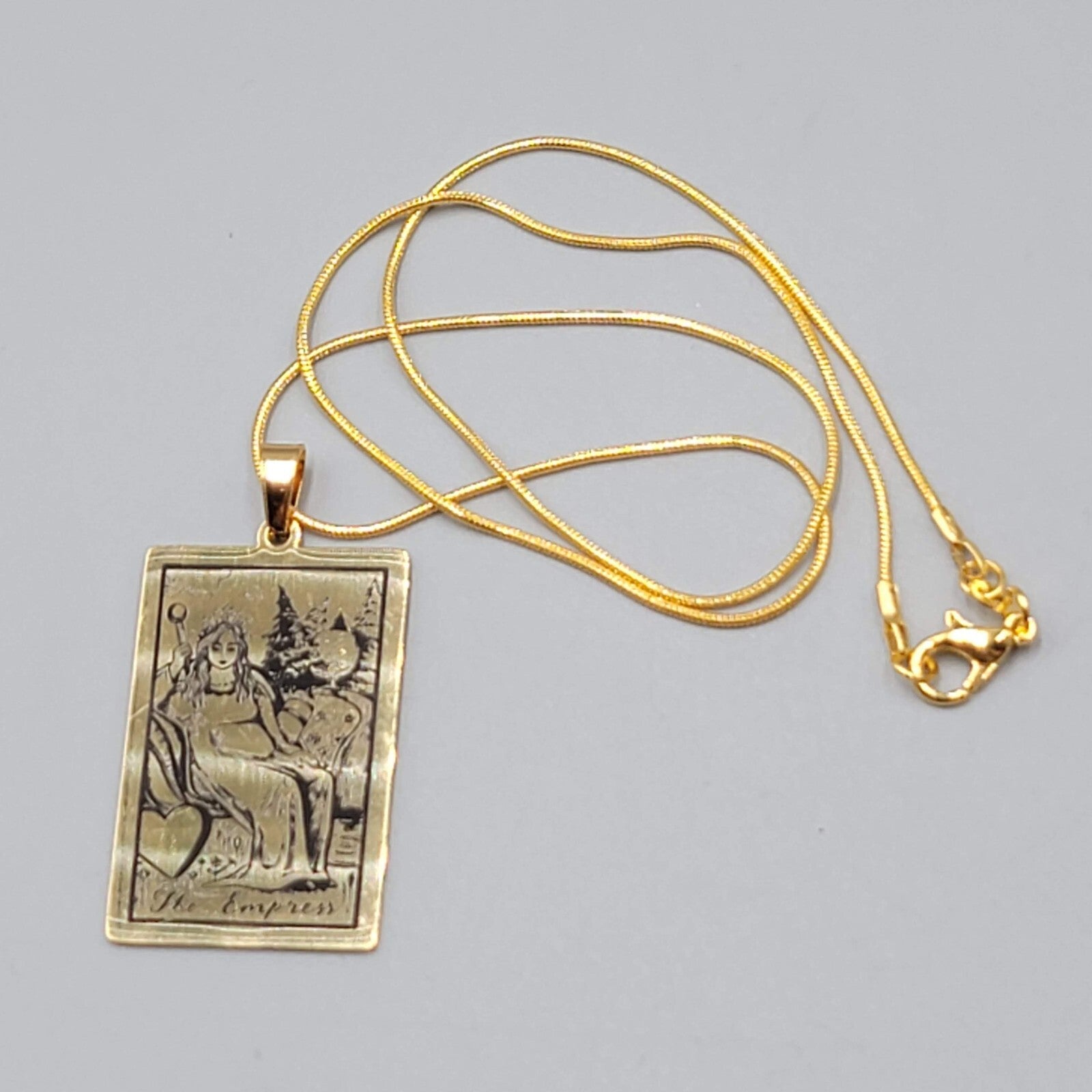 The EMPRESS Tarot Card Pendant Necklace Major Arcana Gold tone 18”.