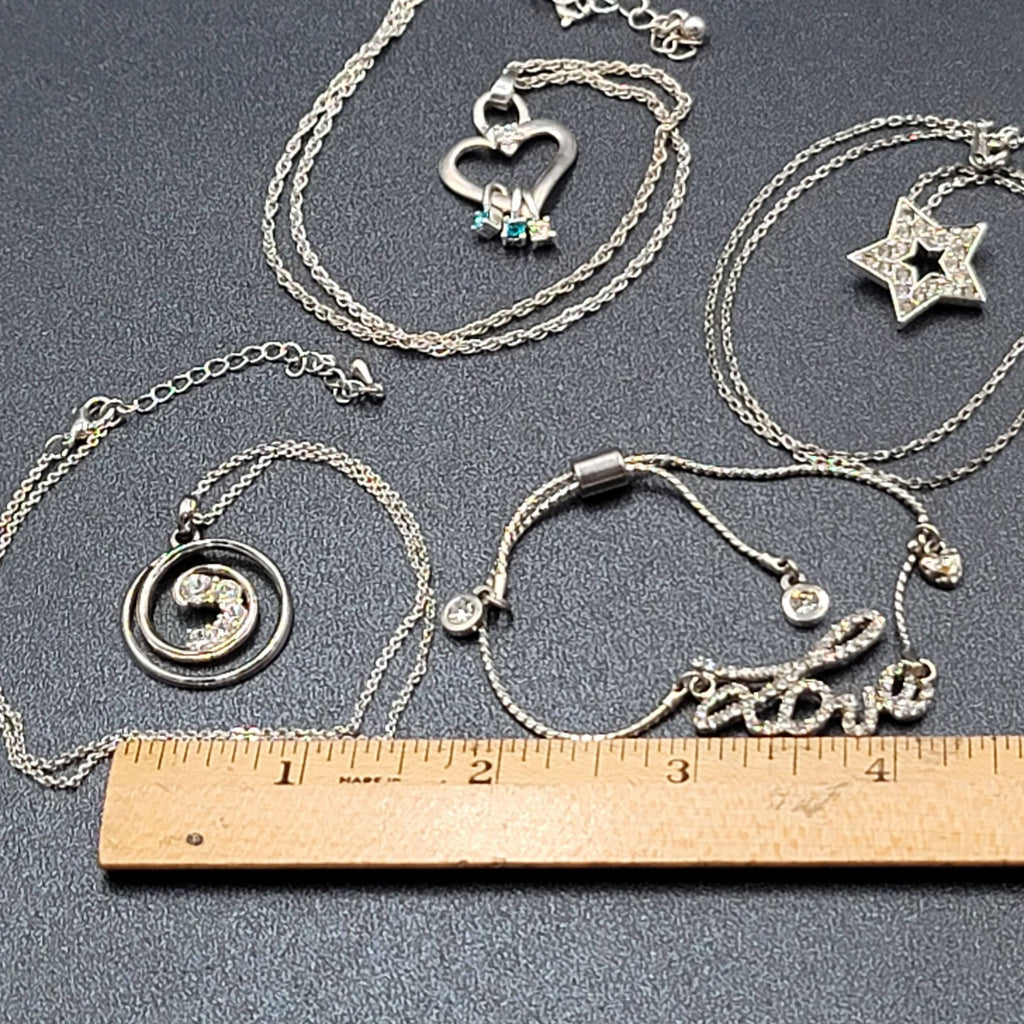 Lot of 4 Costume Crystal Silver tone Jewlery 3 Pendant Necklaces 1 Love Bracelet