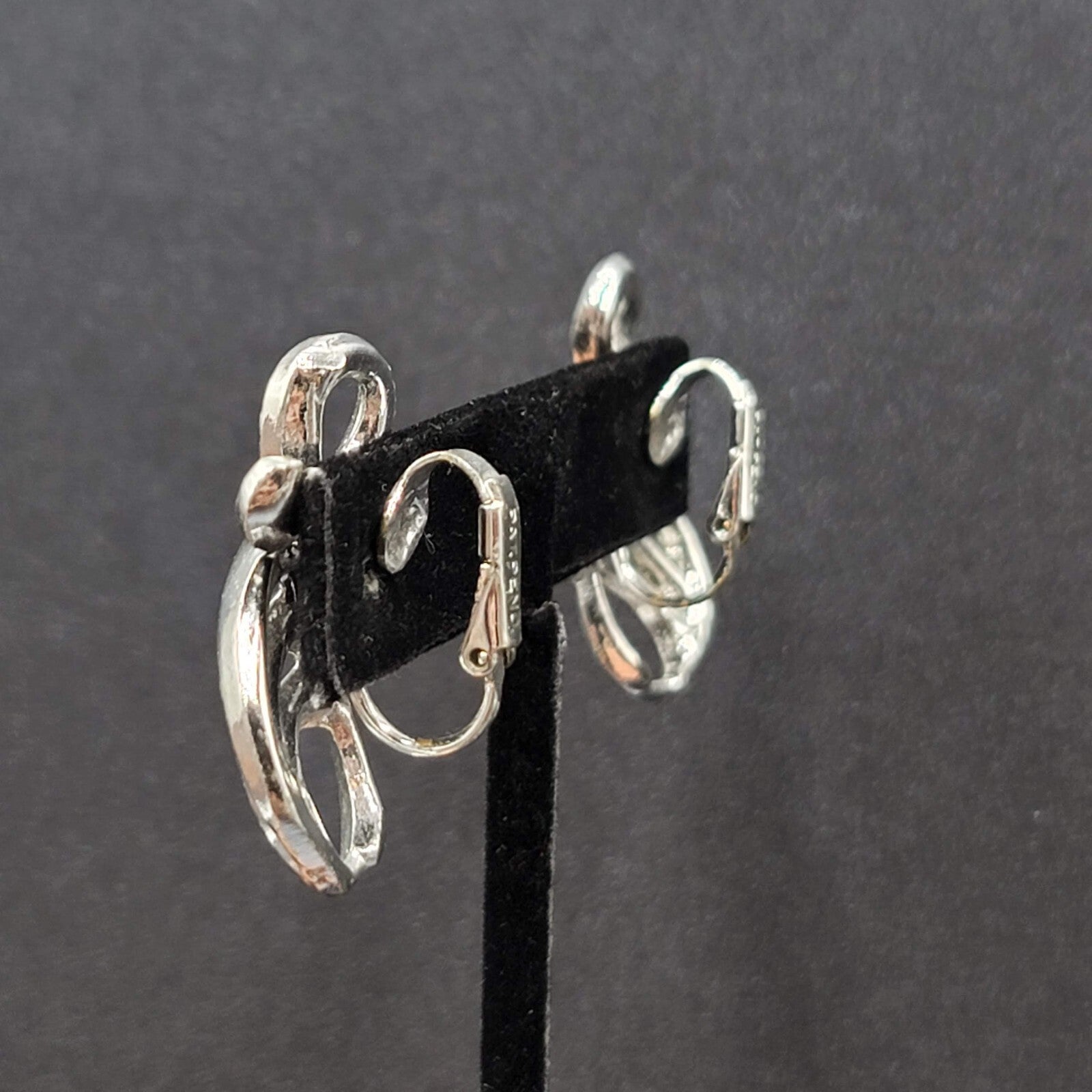 Vintage Clip on Earrings Pat Pend Silver tone Swirl Climber 1.25"