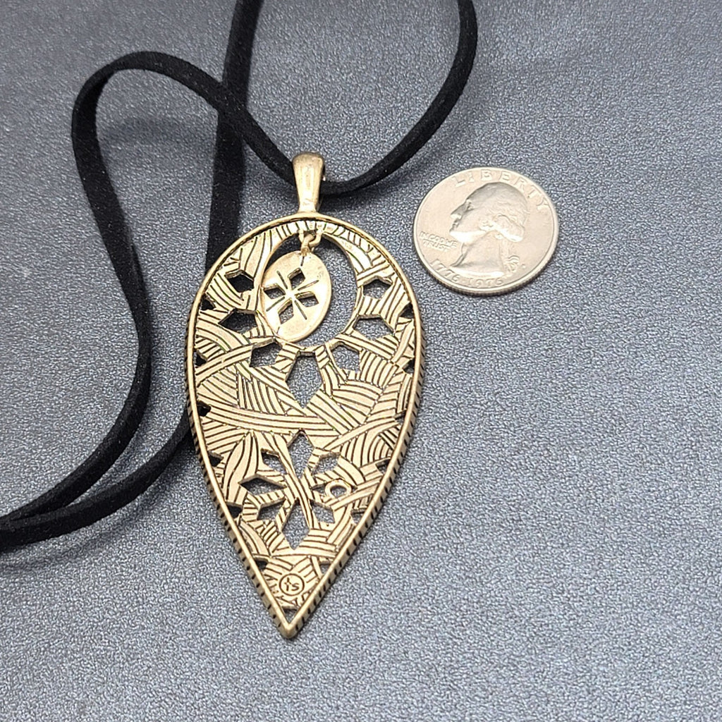 The Sak Necklace Gold tone Pendant Black Faux Leather Cord 28"