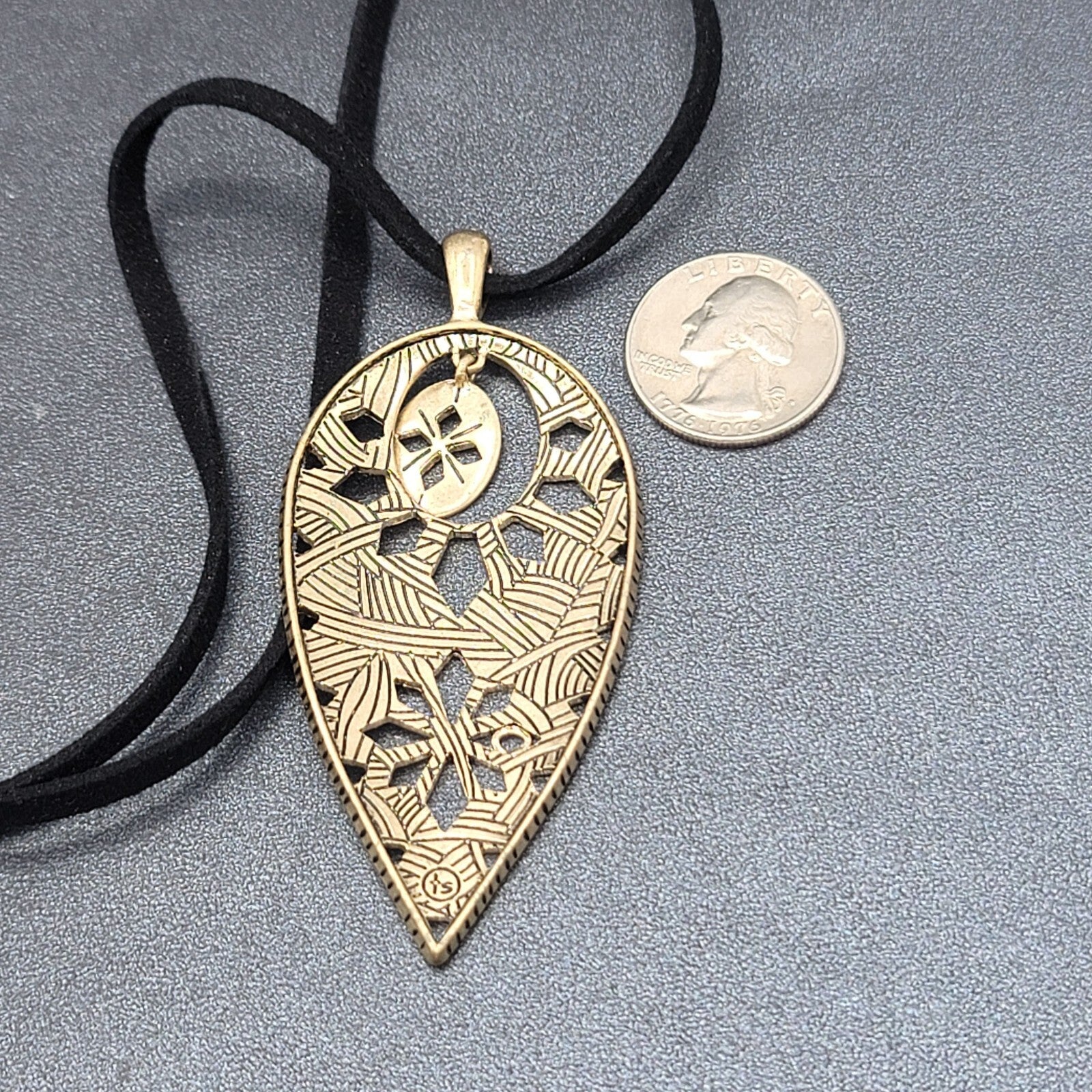 The Sak Necklace Gold tone Pendant Black Faux Leather Cord 28"