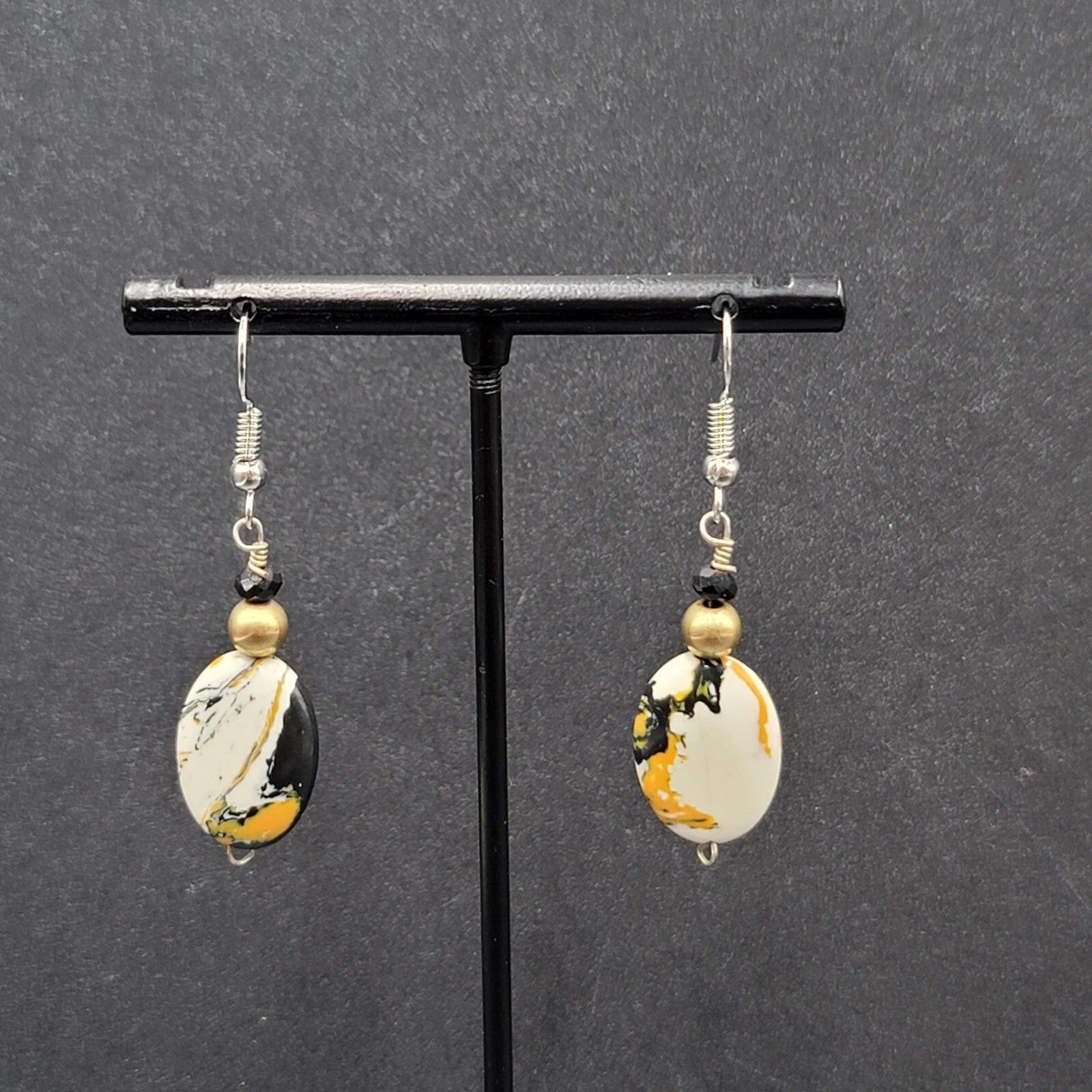 Pierced Earrings Silver tone Black White Yellow Art Glass Oval Bead Dangle 1.25"