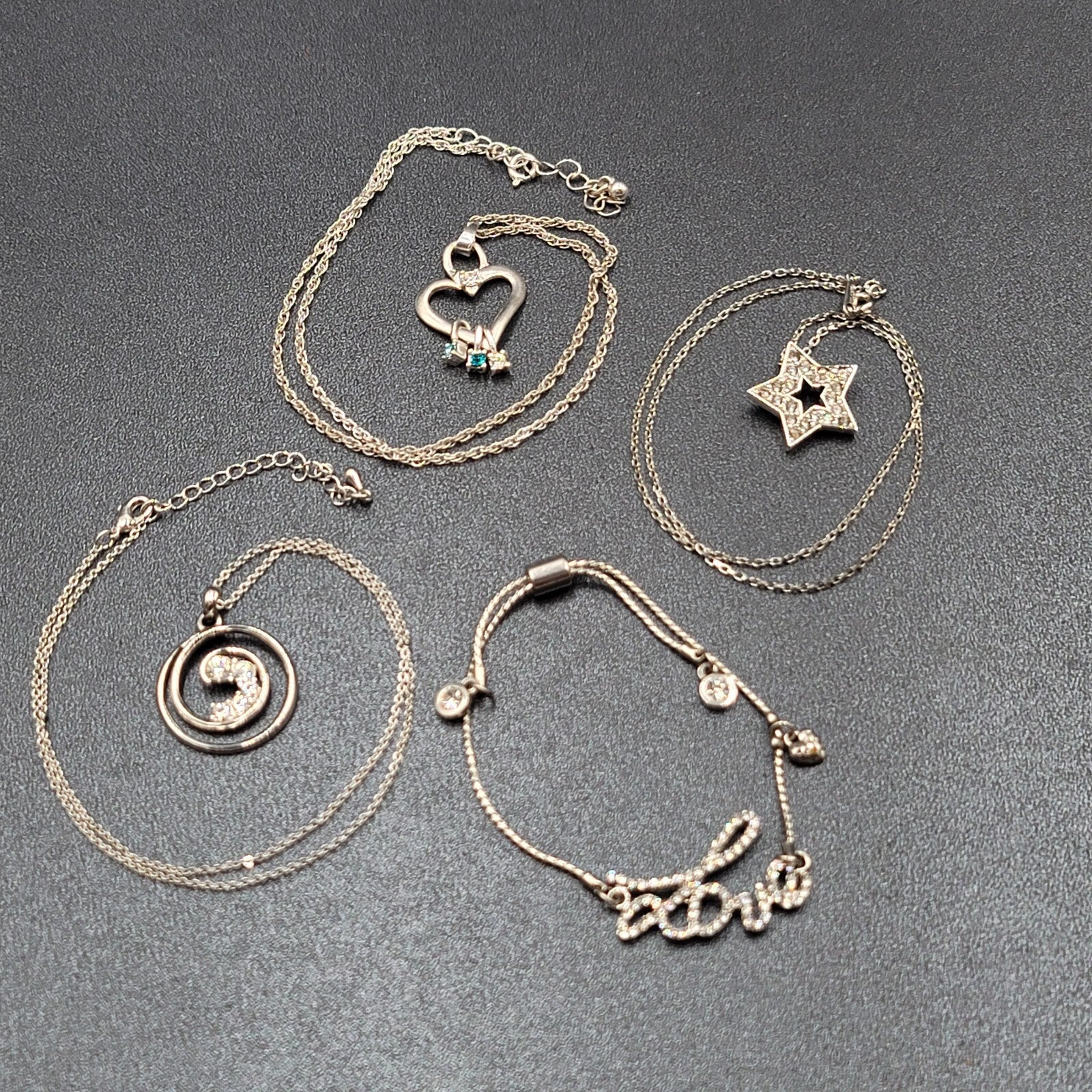 Lot of 4 Costume Crystal Silver tone Jewlery 3 Pendant Necklaces 1 Love Bracelet