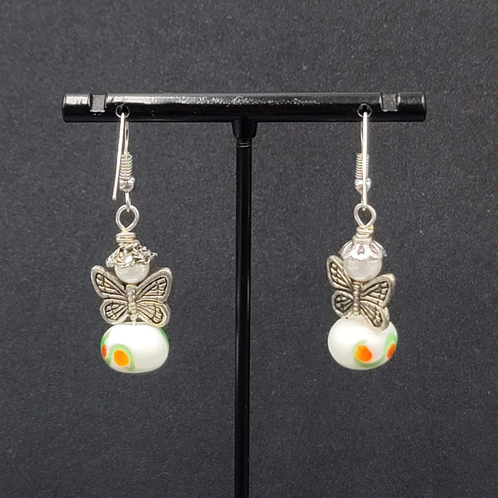 Pierced Earrings Silver tone Angel White Art Glass Bead Dangle 1"