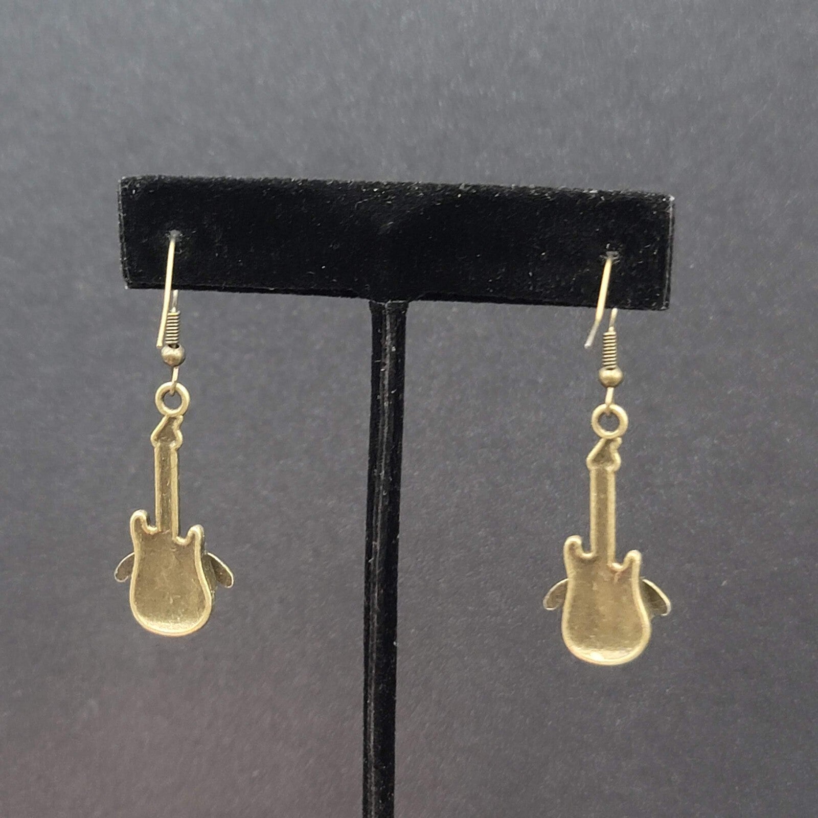 Pierced Earrings Bronze tone Embossed Winged Guitar Dangle 1.25"