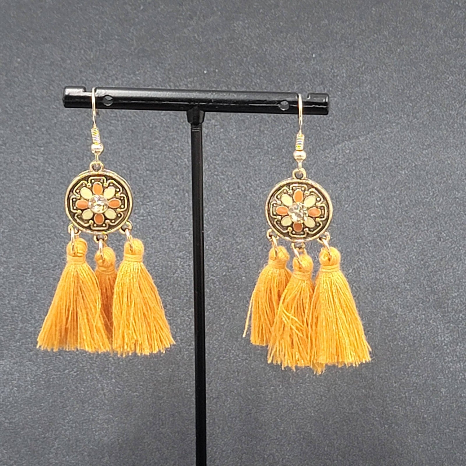 Pierced Earrings Gold tone Orange Tassel Rhinestone Medallion Dangle 1.75"