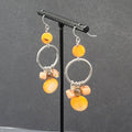 Pierced Earrings Silver tone Orange Shells Dangle Beads 2"