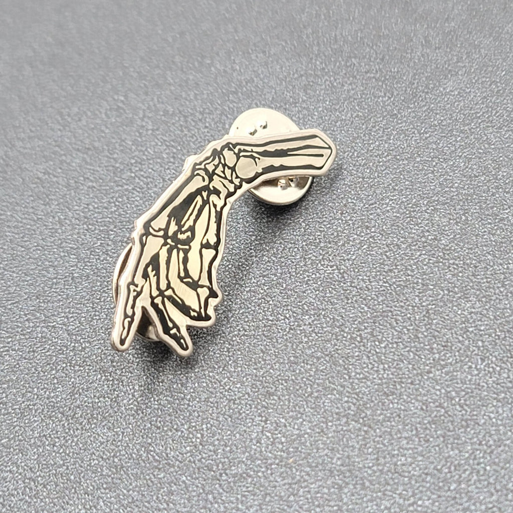 Skeleton Hand Pointing Lapel Pin Black Silver Goth Oddity 1.5"