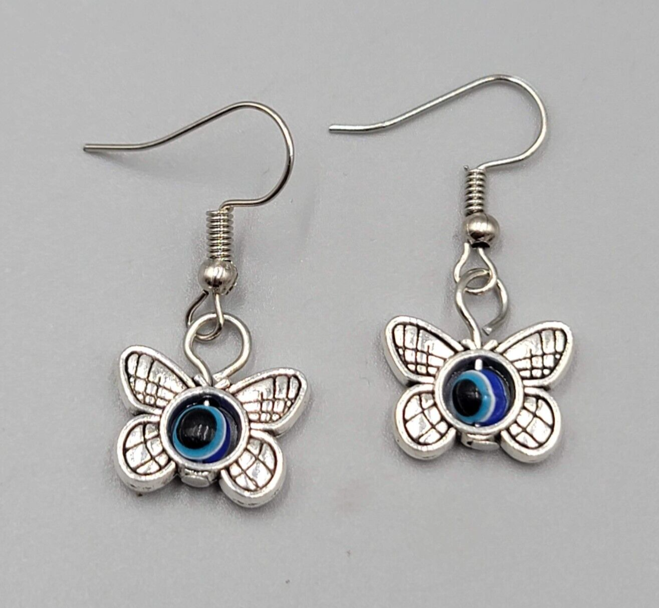 Butterfly Evil Eye Pierced Earrings Silver tone Blue Bead Dangle 5/8"